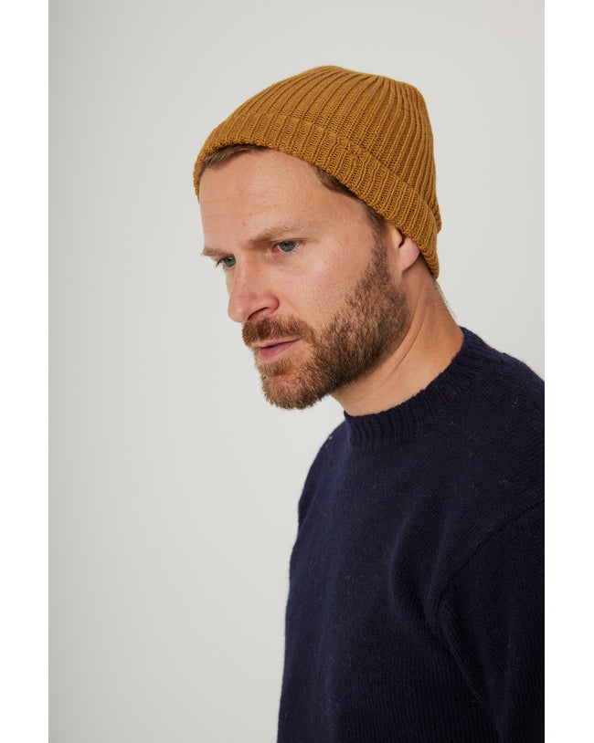 Image of model wearing Porter Ribbed Beanie. One Size