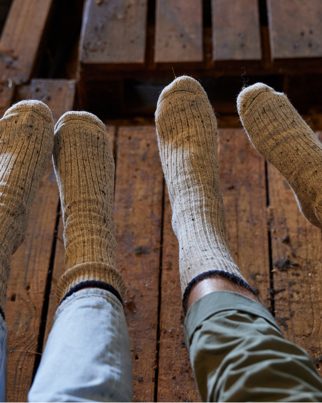 Image of model wearing Boot Socks. Small - UK4-7/ Large - UK 8-12