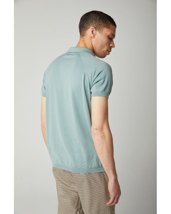 Image of model wearing Knitted Emery Polo Shirt. Model is 6ft, chest size 36in and wearing size Medium
