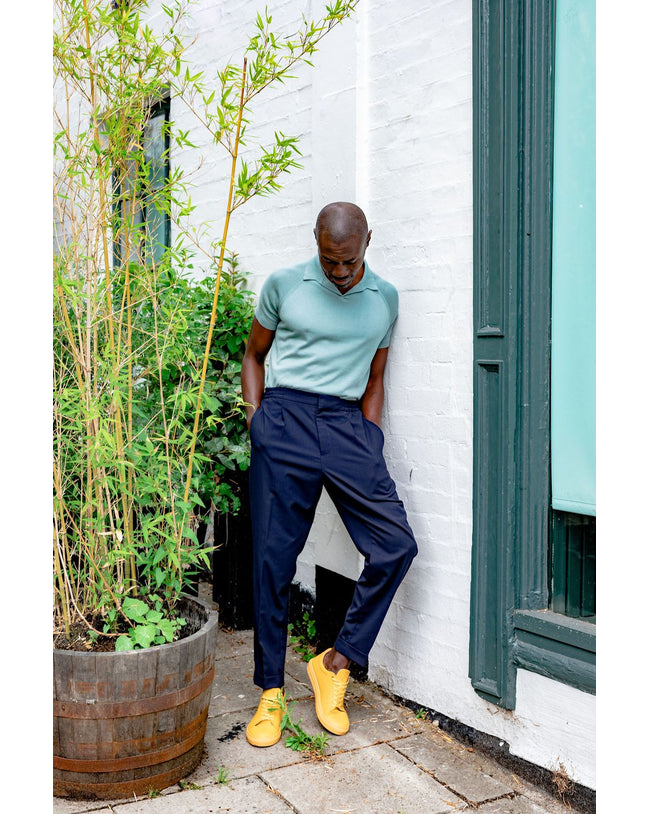 Image of model wearing Knitted Emery Polo Shirt. Model is 6ft, chest size 36in and wearing size Medium