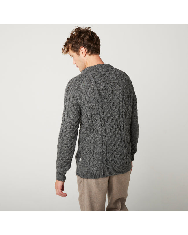 Image of model wearing Hudson Aran Jumper. Model is 6ft1in, chest size 38in and wearing size Medium