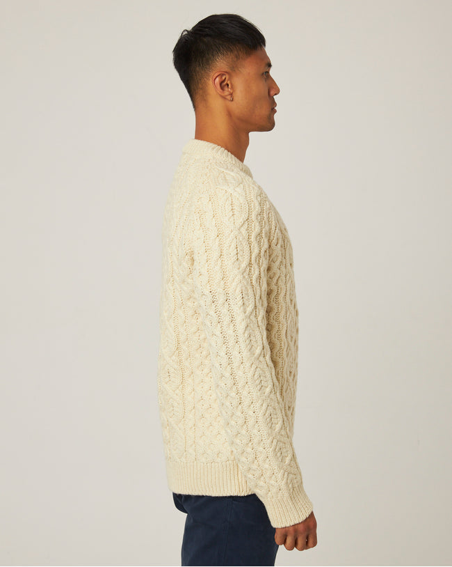 Image of model wearing Hudson Aran Jumper. Model is 6ft1in, chest size 38in and wearing size Large