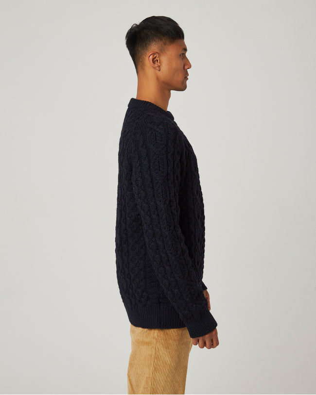 Image of model wearing Hudson Aran Jumper. Model is 6ft1in, chest size 38in and wearing size Medium