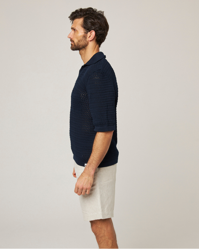 Image of model wearing Island Crochet Polo Shirt.