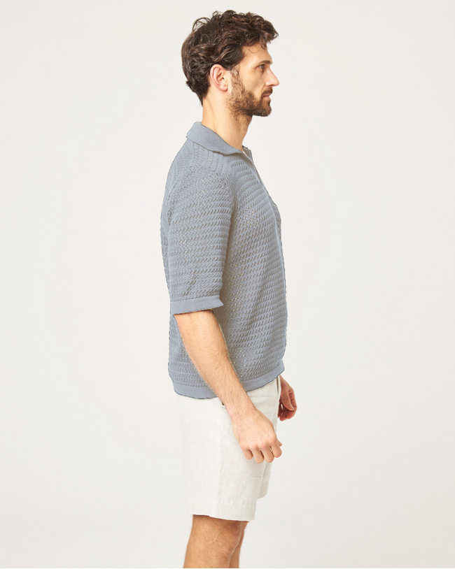 Image of model wearing Island Crochet Polo Shirt.