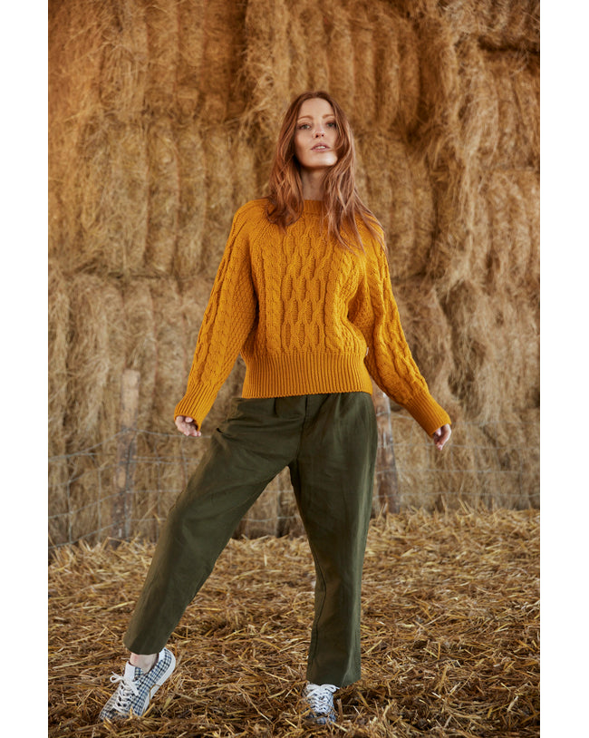 Image of model wearing Isobel Aran Jumper. Model is 5ft8, size UK 8 and wearing size Medium