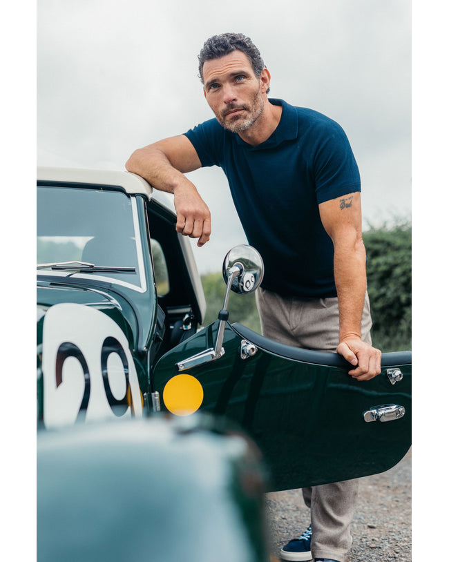 Image of model wearing Knitted Emery Polo Shirt. Model is 6ft, chest size 36in and wearing size Medium