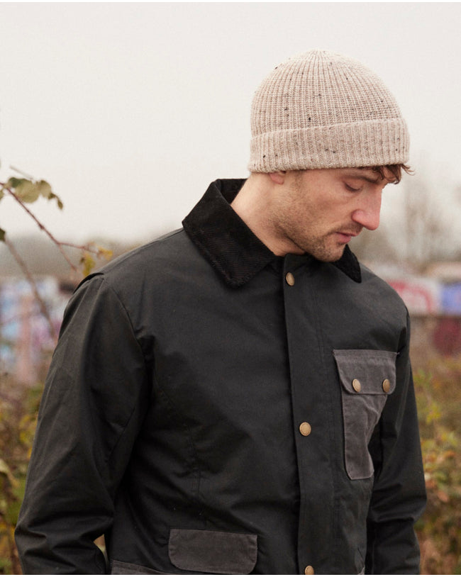 Image of model wearing Porter Ribbed Beanie. One Size