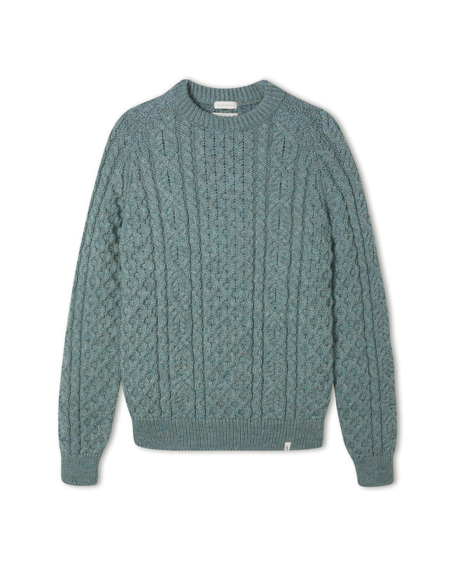 Image of model wearing Hudson Aran Jumper. Model is 6ft1in, chest size 40in and wearing size Large