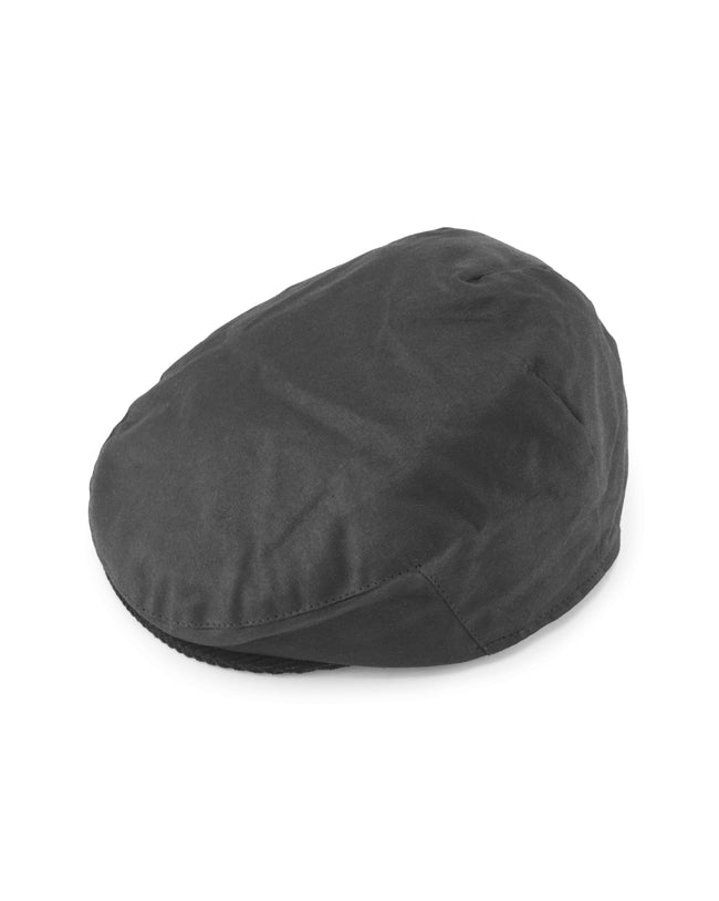 Image of model wearing Wax Flat Cap.