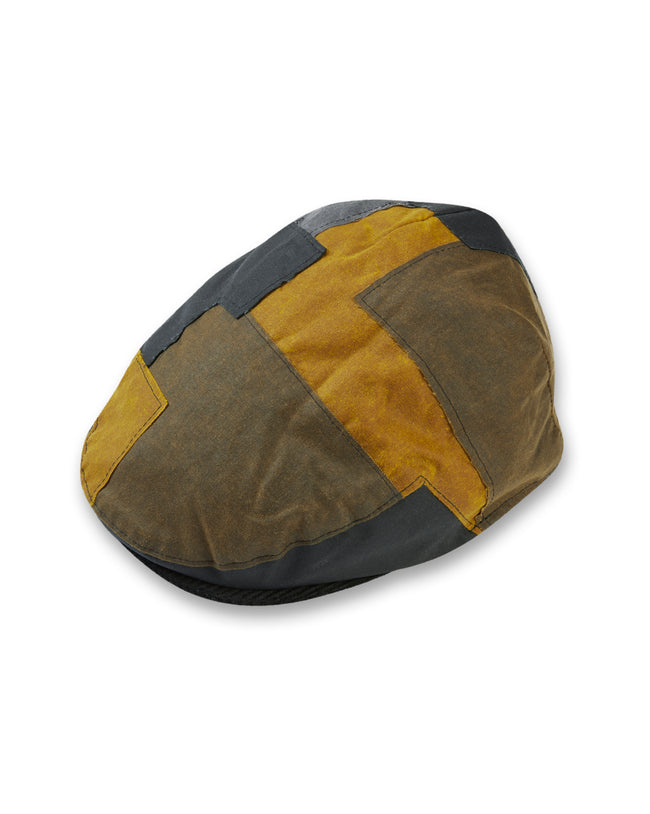 Image of model wearing Wax Flat Cap.