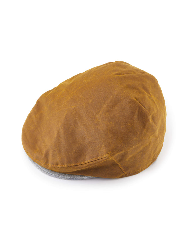 Image of model wearing Wax Flat Cap.