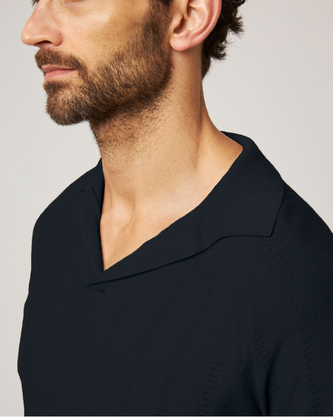 Image of model wearing Alma Polo shirt.