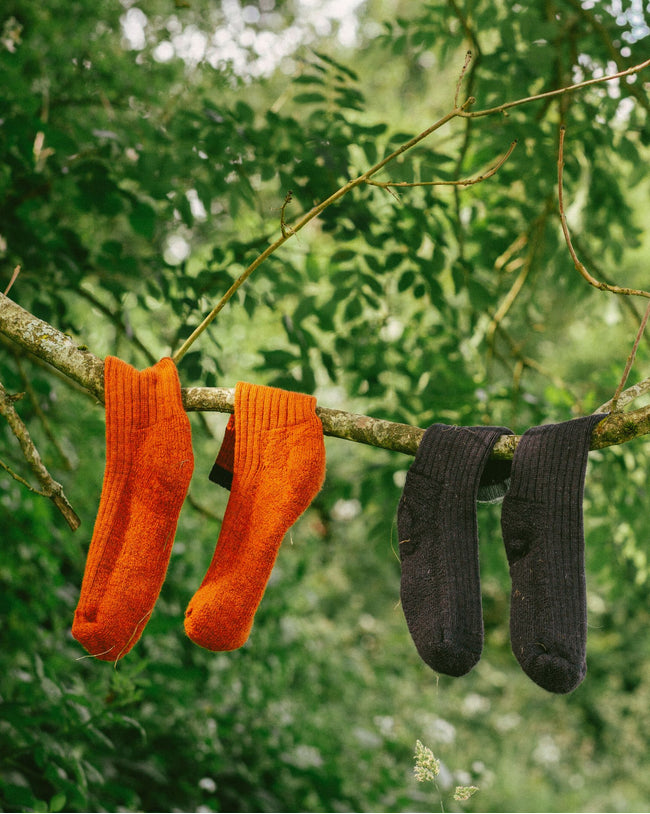 Image of model wearing Boot Socks. Small - UK4-7/ Large - UK 8-12