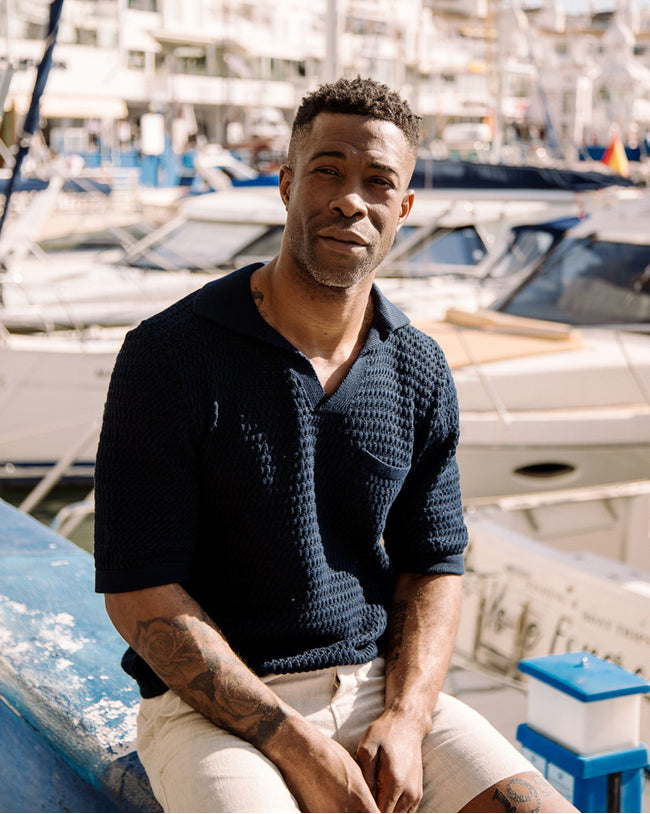 Image of model wearing Island Crochet Polo Shirt.