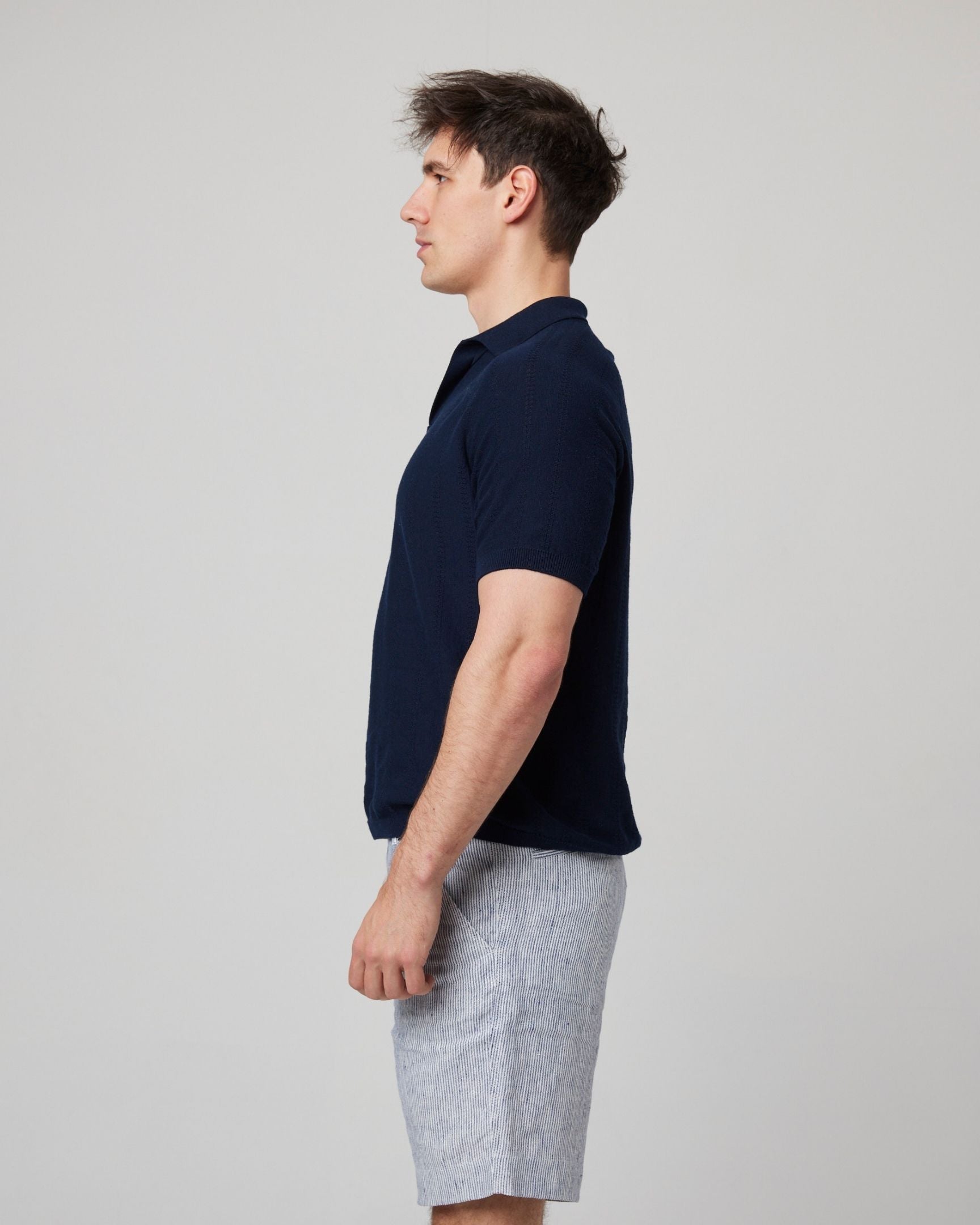 Image of model wearing Alma Polo shirt. 