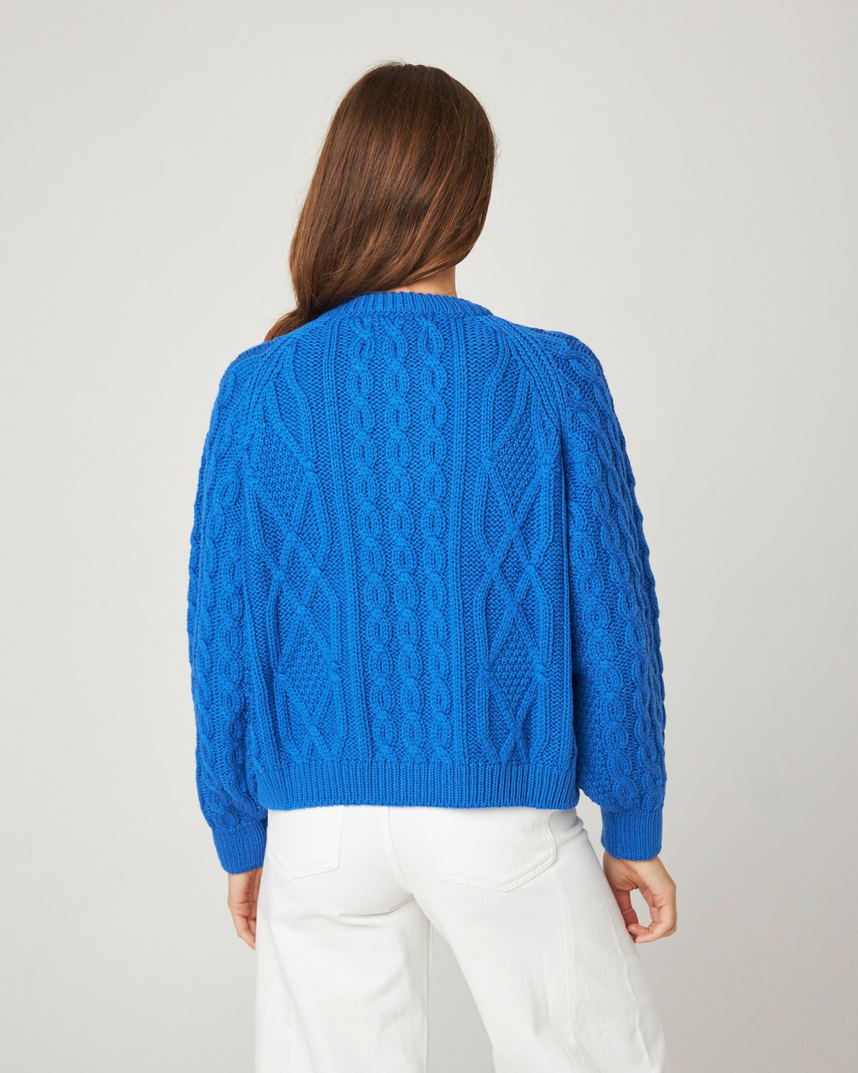 Image of model wearing Beckett Cable Knit Cardigan. 