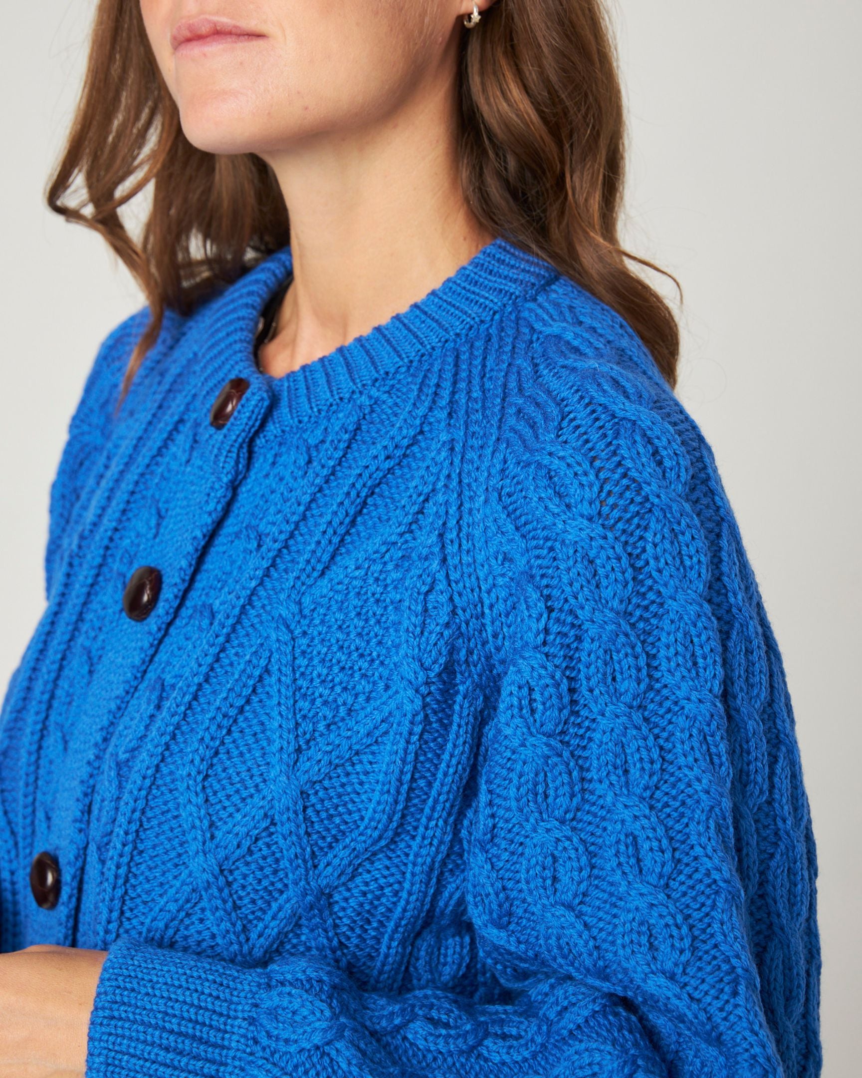 Image of model wearing Beckett Cable Knit Cardigan. 