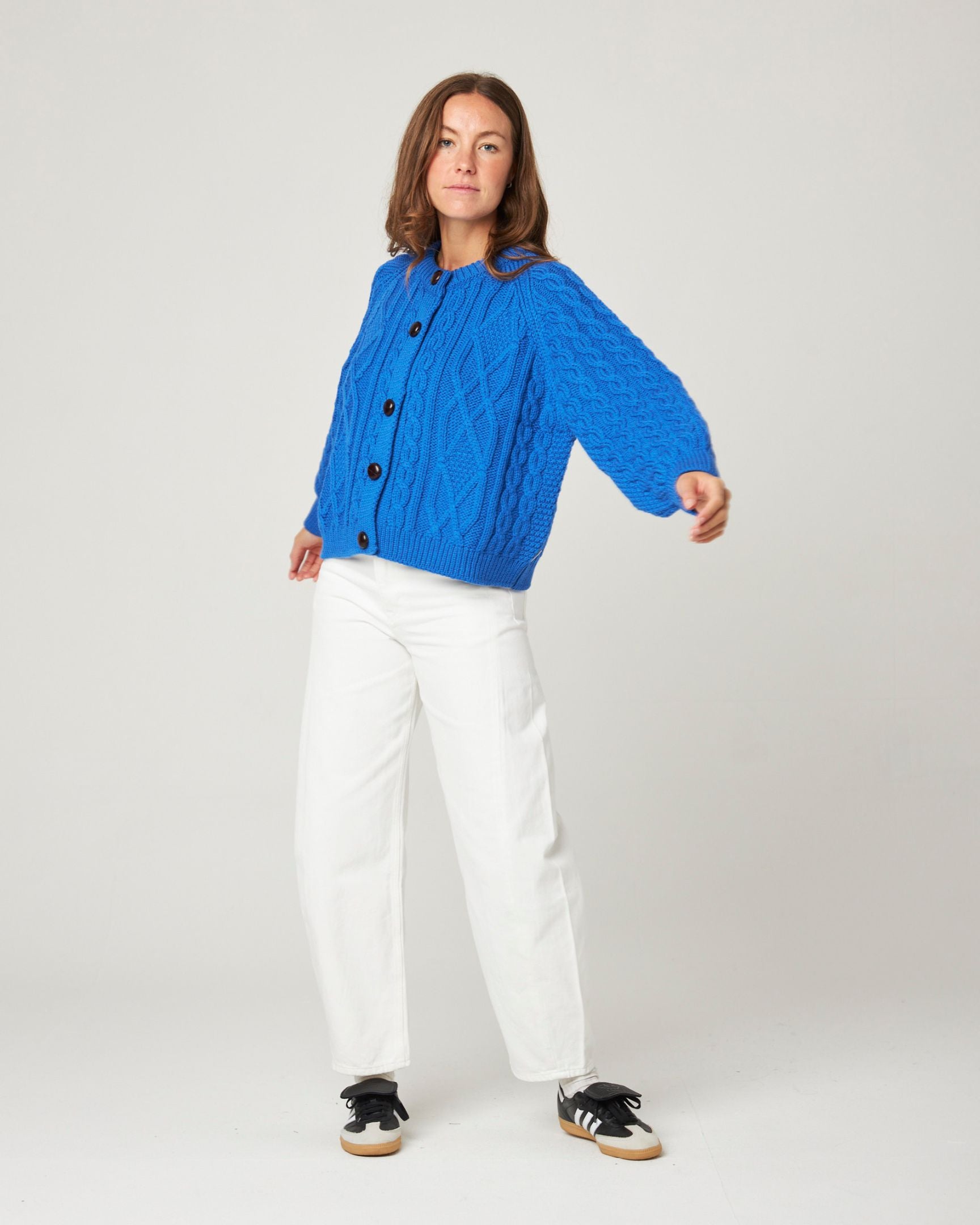 Image of model wearing Beckett Cable Knit Cardigan. 