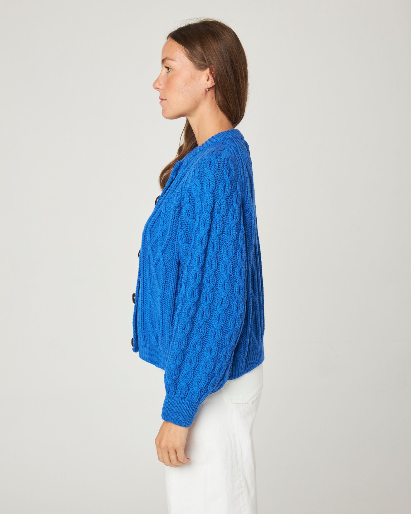 Image of model wearing Beckett Cable Knit Cardigan. 