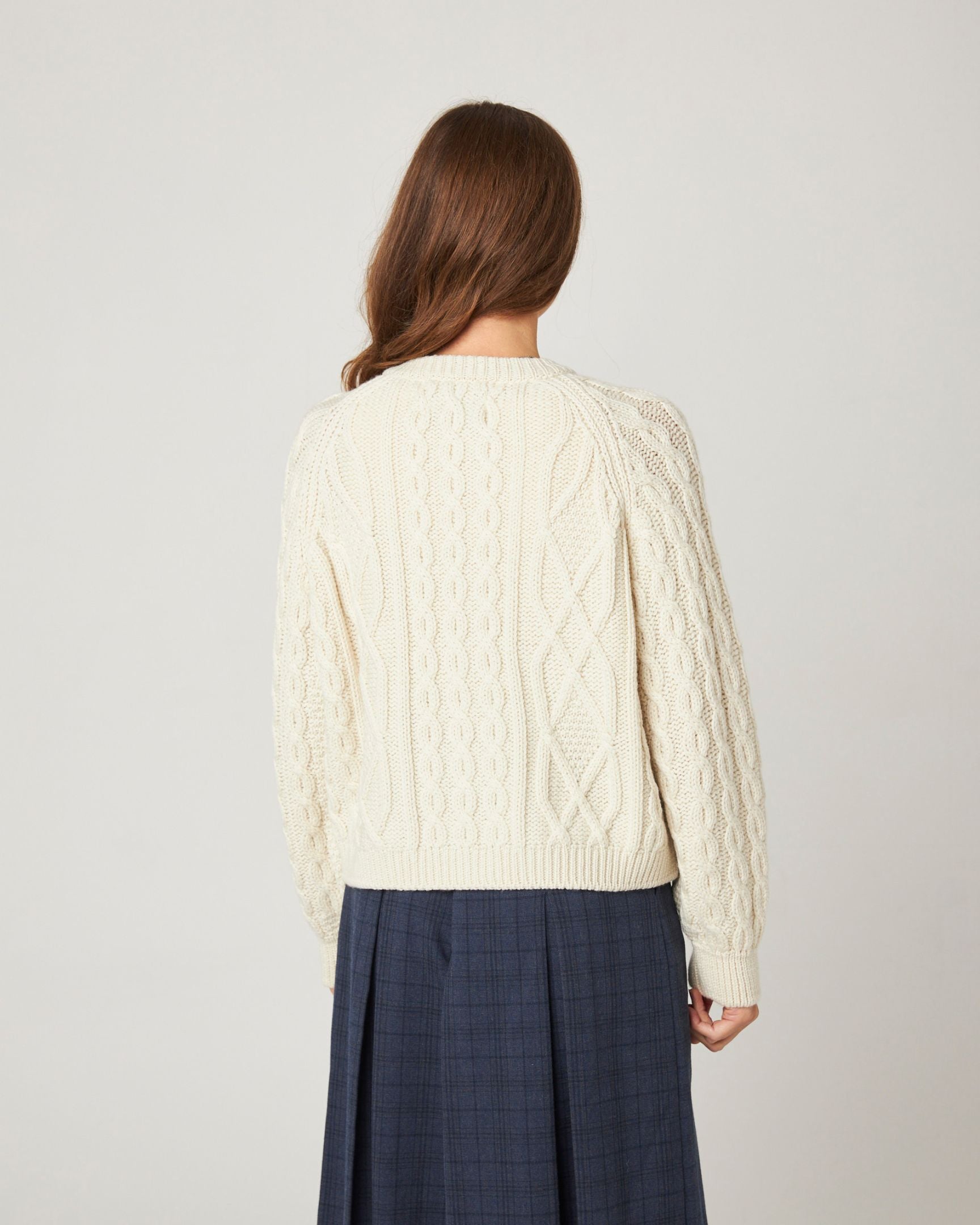 Image of model wearing Beckett Cable Knit Cardigan. 
