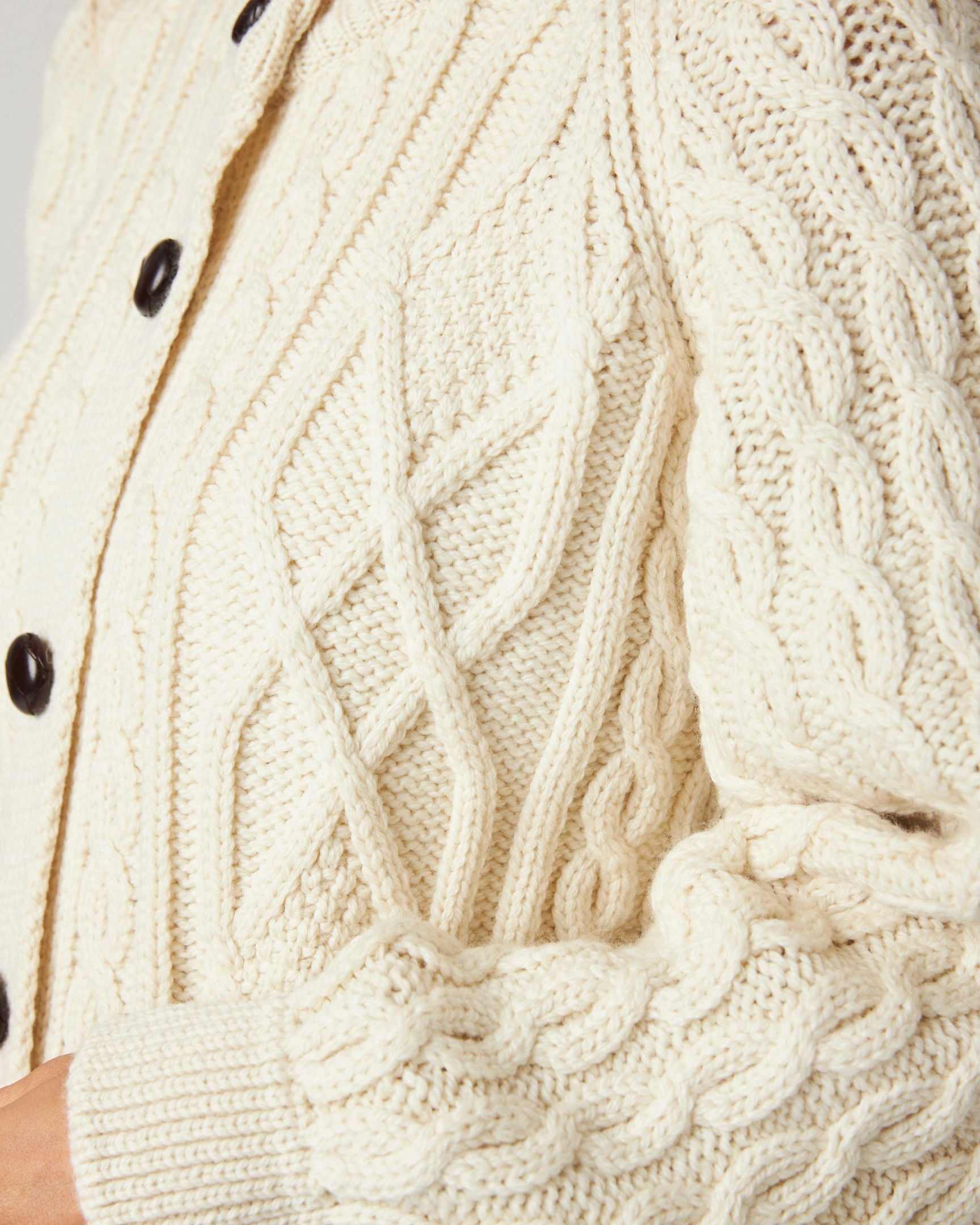 Image of model wearing Beckett Cable Knit Cardigan. 