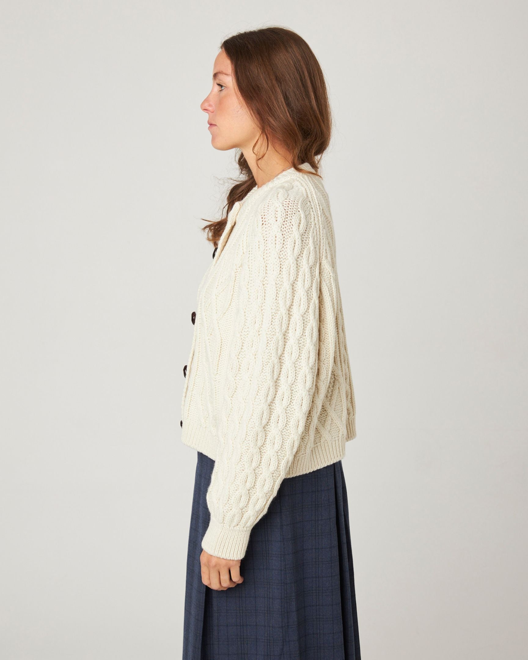 Image of model wearing Beckett Cable Knit Cardigan. 