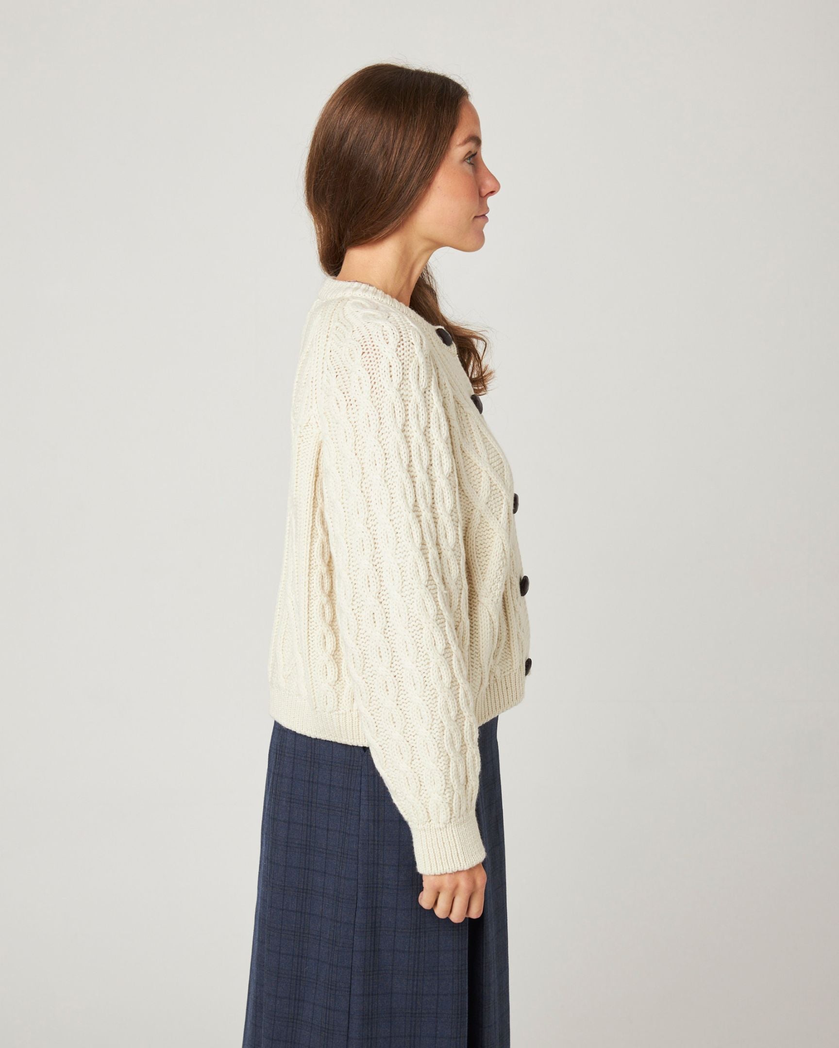 Image of model wearing Beckett Cable Knit Cardigan. 
