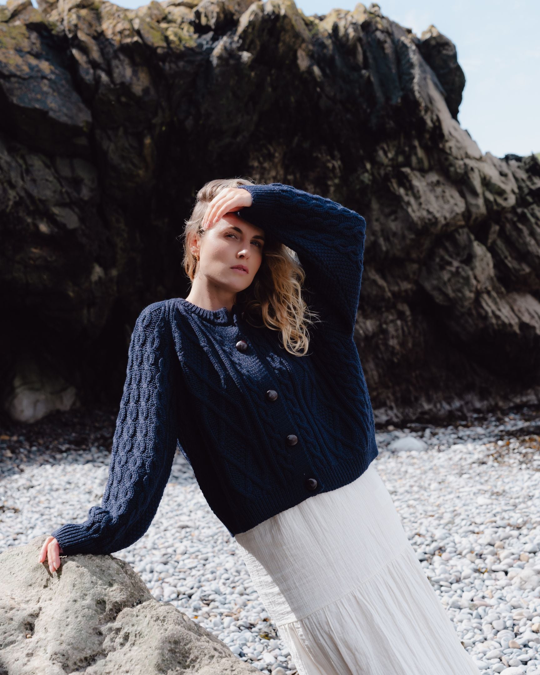 Image of model wearing Beckett Cable Knit Cardigan. 