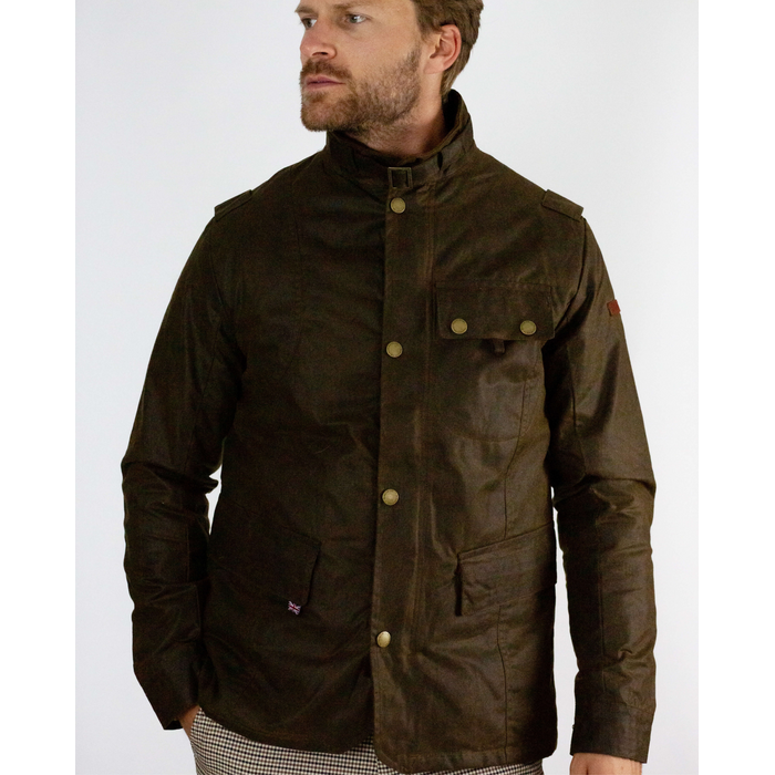 A flatlay image a brown Bexley Jacket. The jacket has full length sleeves and three pocket, two hand pockets at the hem on the jacket and one chest pocket. The jacket has a zip and popper close. The jacket has a funnel neck with a buckle strap to close the neck. There is a small union jack label on the right pocket. 