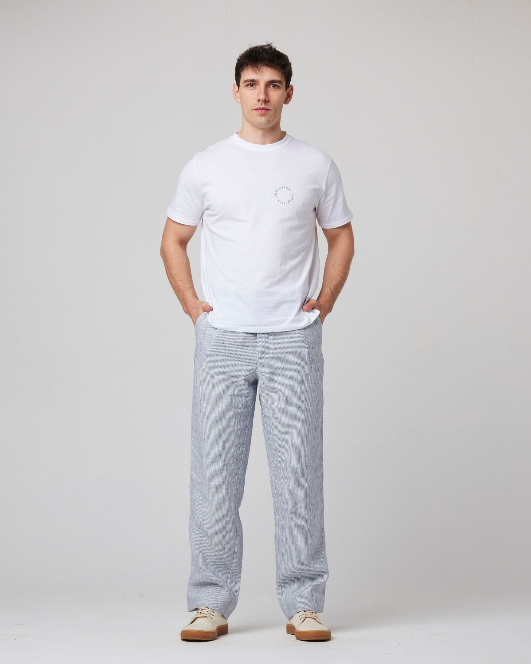 Image of model wearing Peregrine Graphic T-Shirt. 