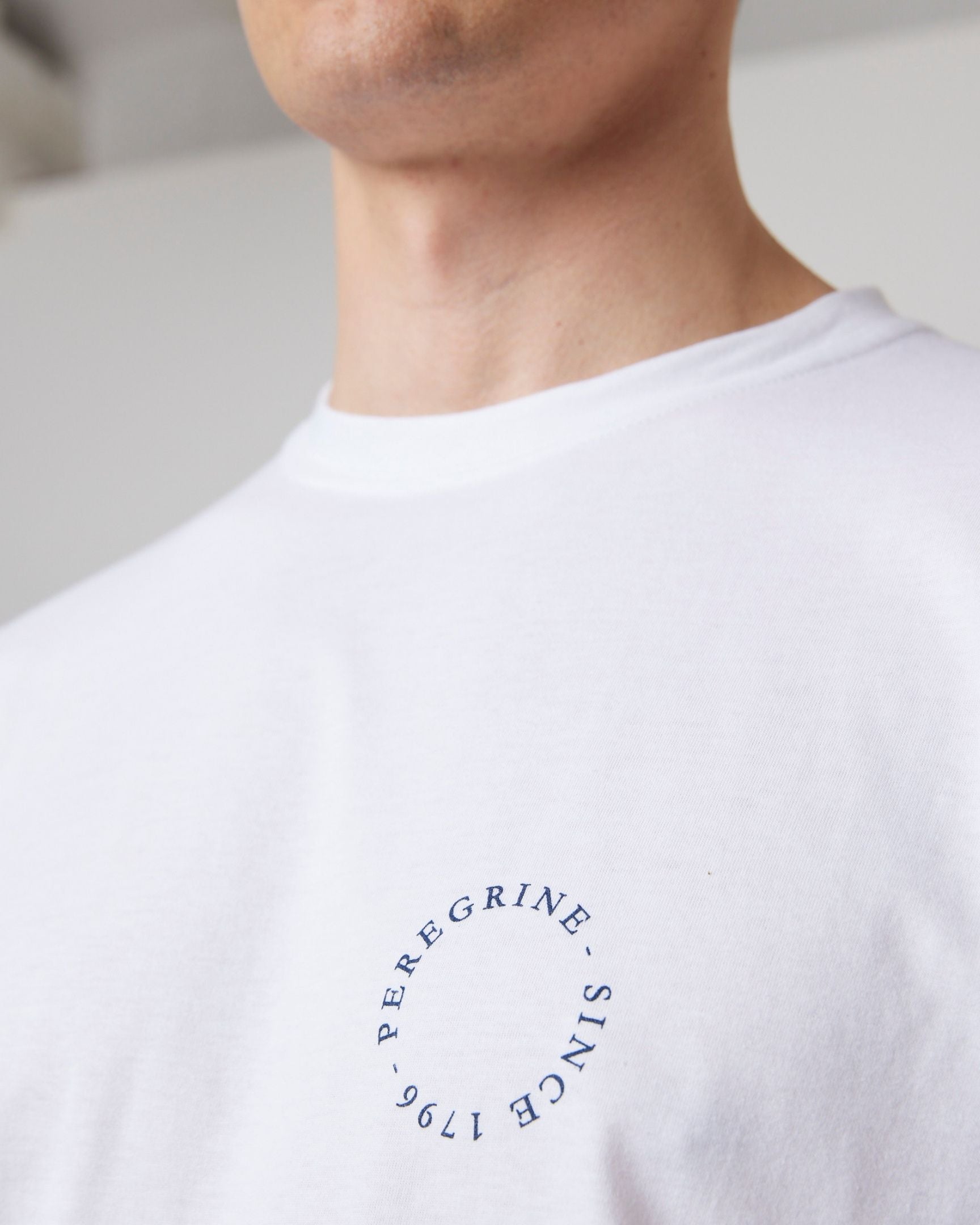 Image of model wearing Peregrine Graphic T-Shirt. 