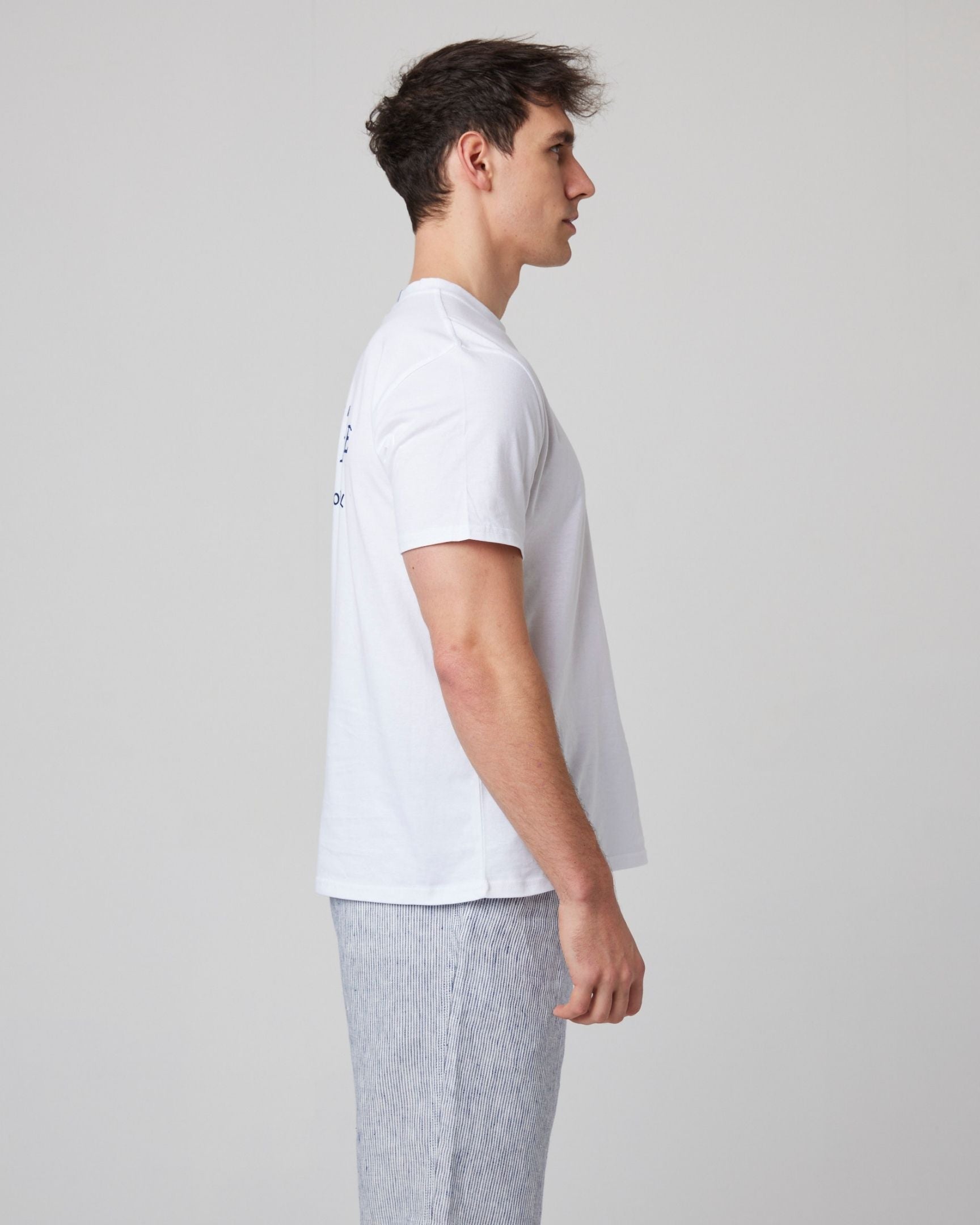 Image of model wearing Peregrine Graphic T-Shirt. 