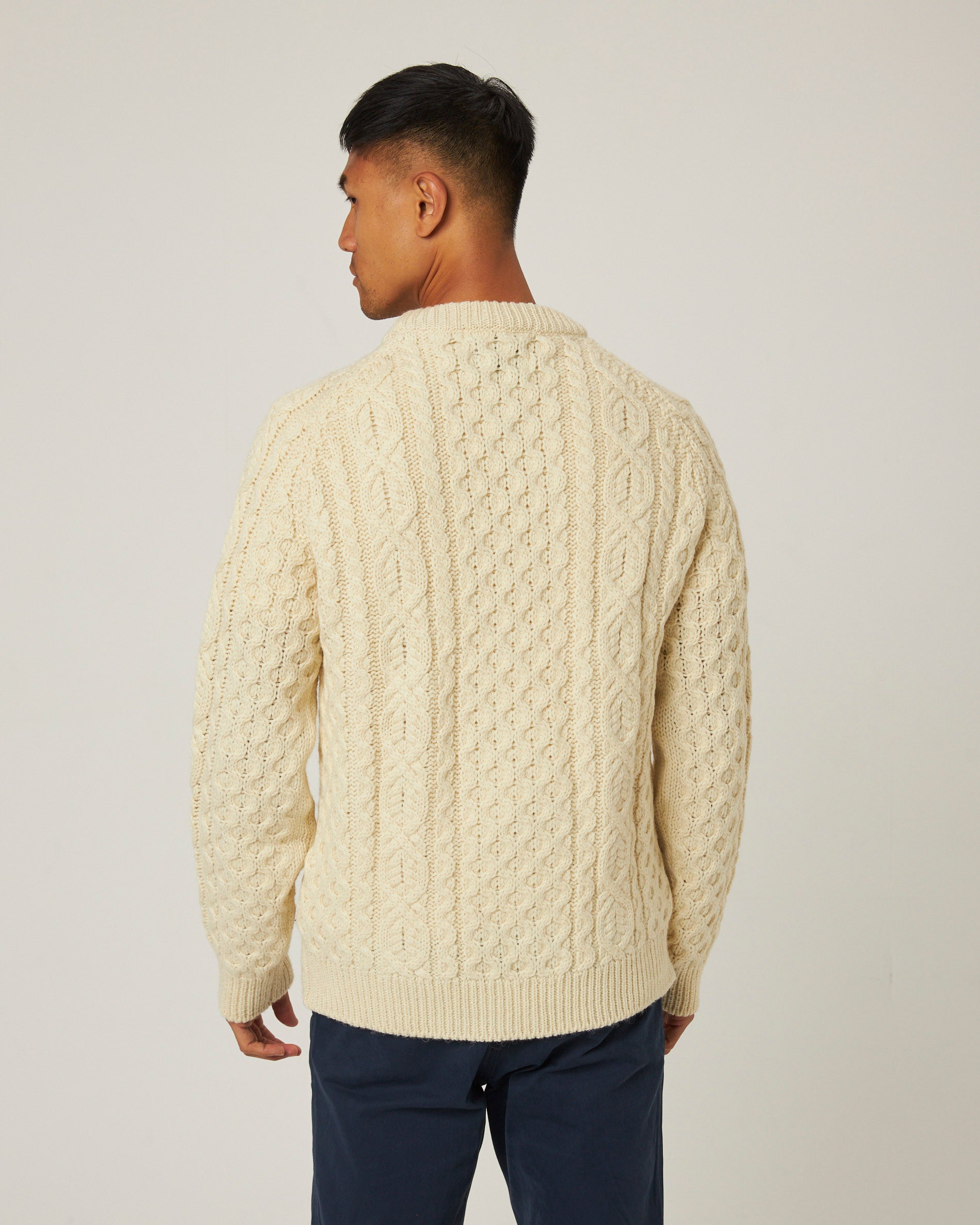 Image of model wearing Hudson Aran Jumper. Model is 6ft1in, chest size 38in and wearing size Large