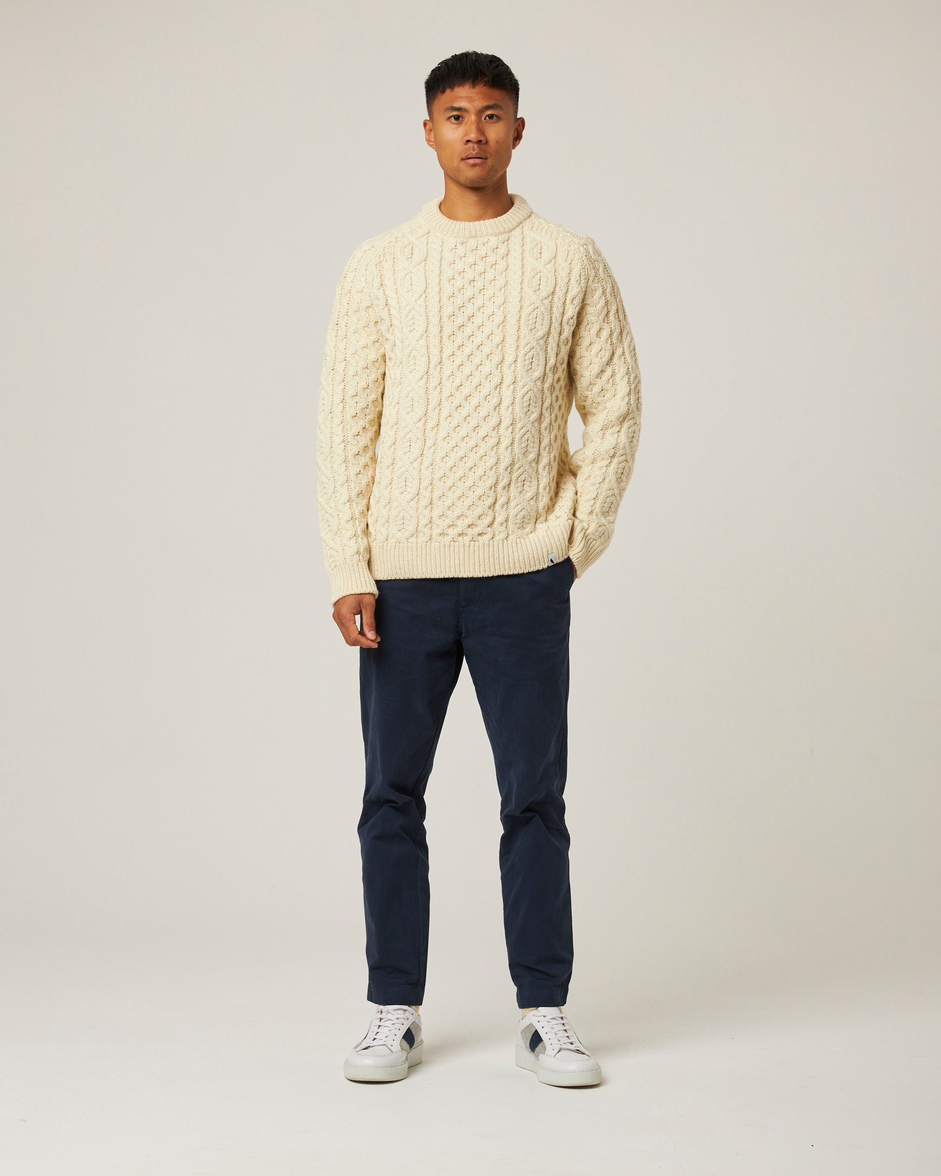 Image of model wearing Hudson Aran Jumper. Model is 6ft1in, chest size 38in and wearing size Large