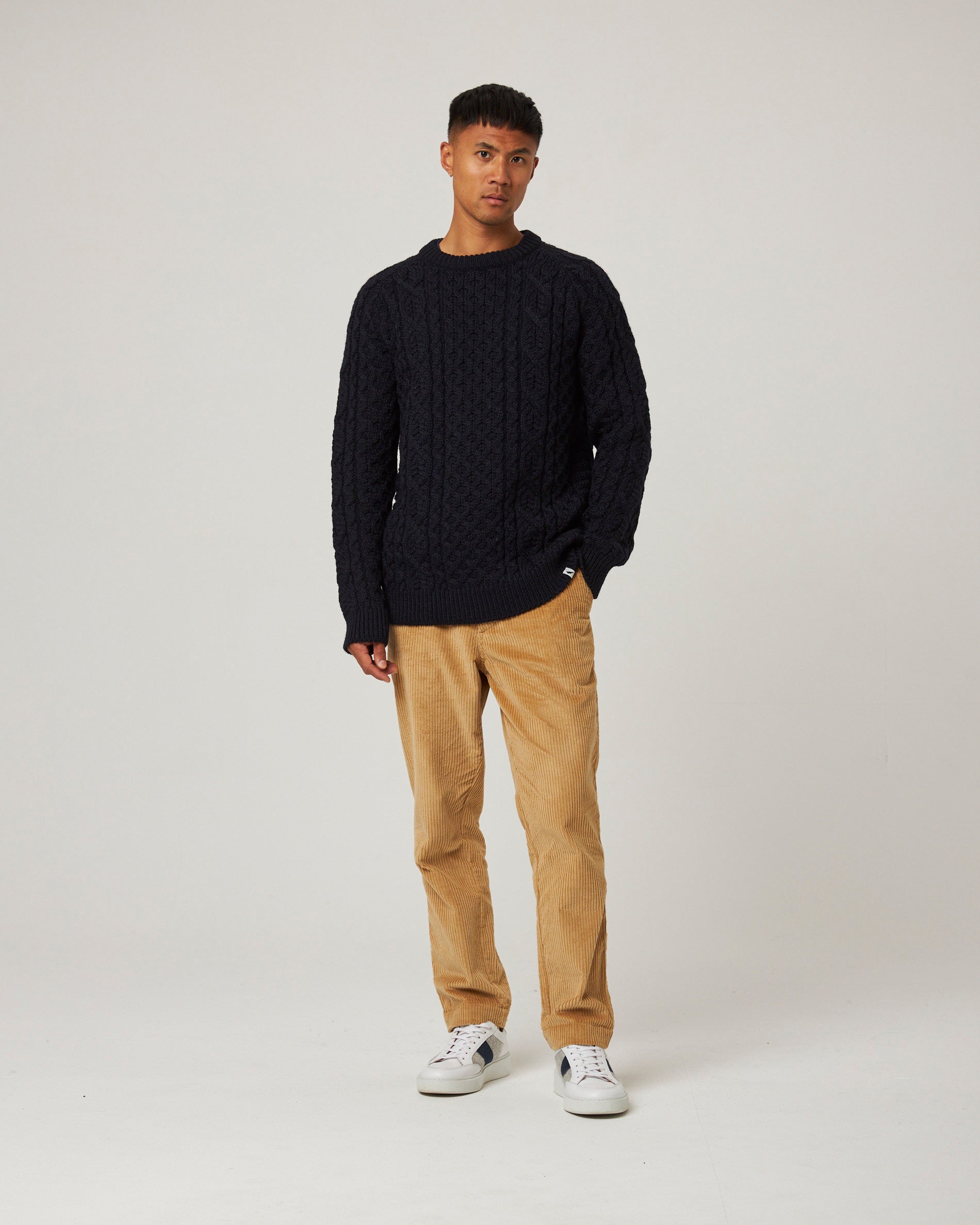 Image of model wearing Hudson Aran Jumper. Model is 6ft1in, chest size 38in and wearing size Medium