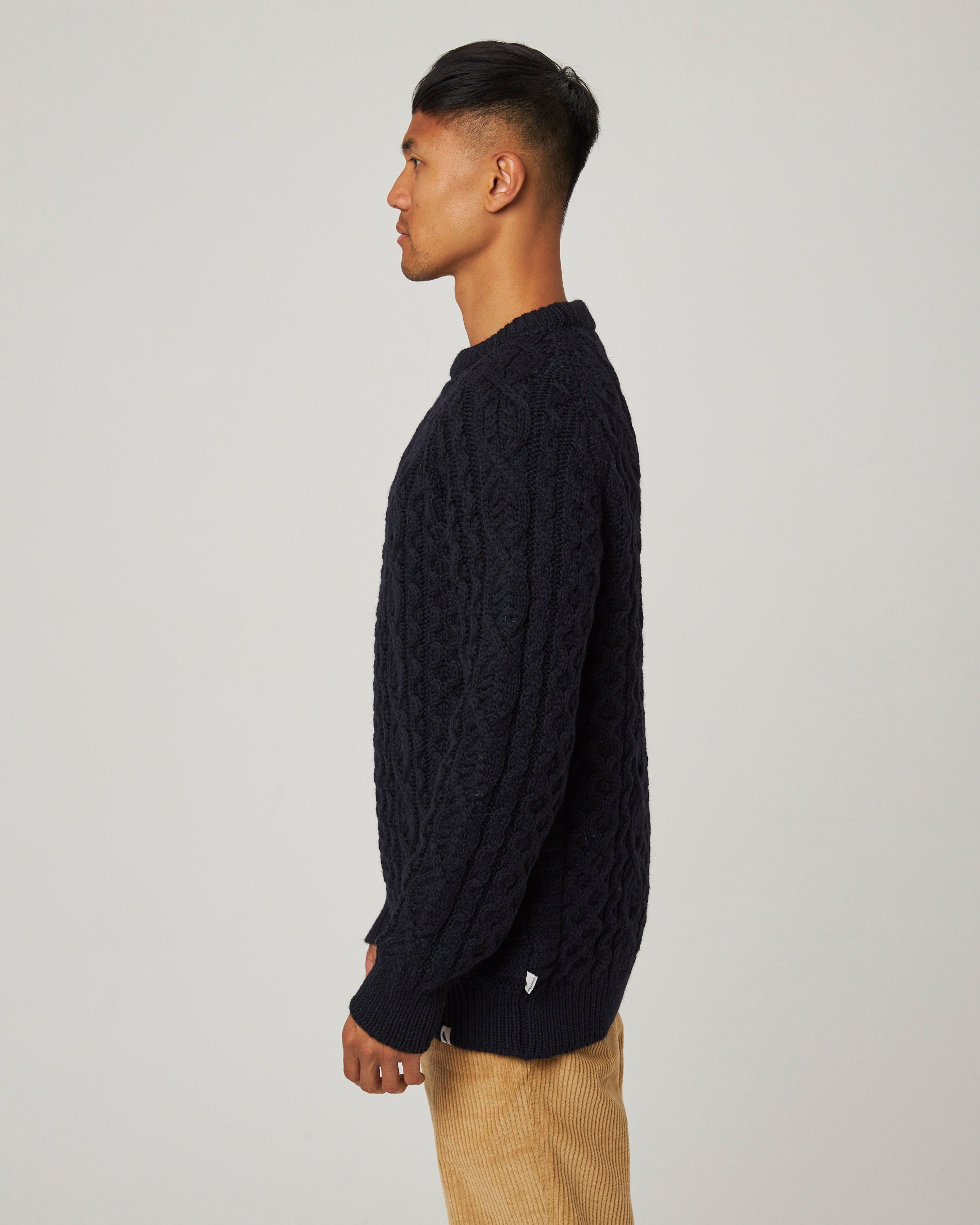 Image of model wearing Hudson Aran Jumper. Model is 6ft1in, chest size 38in and wearing size Medium