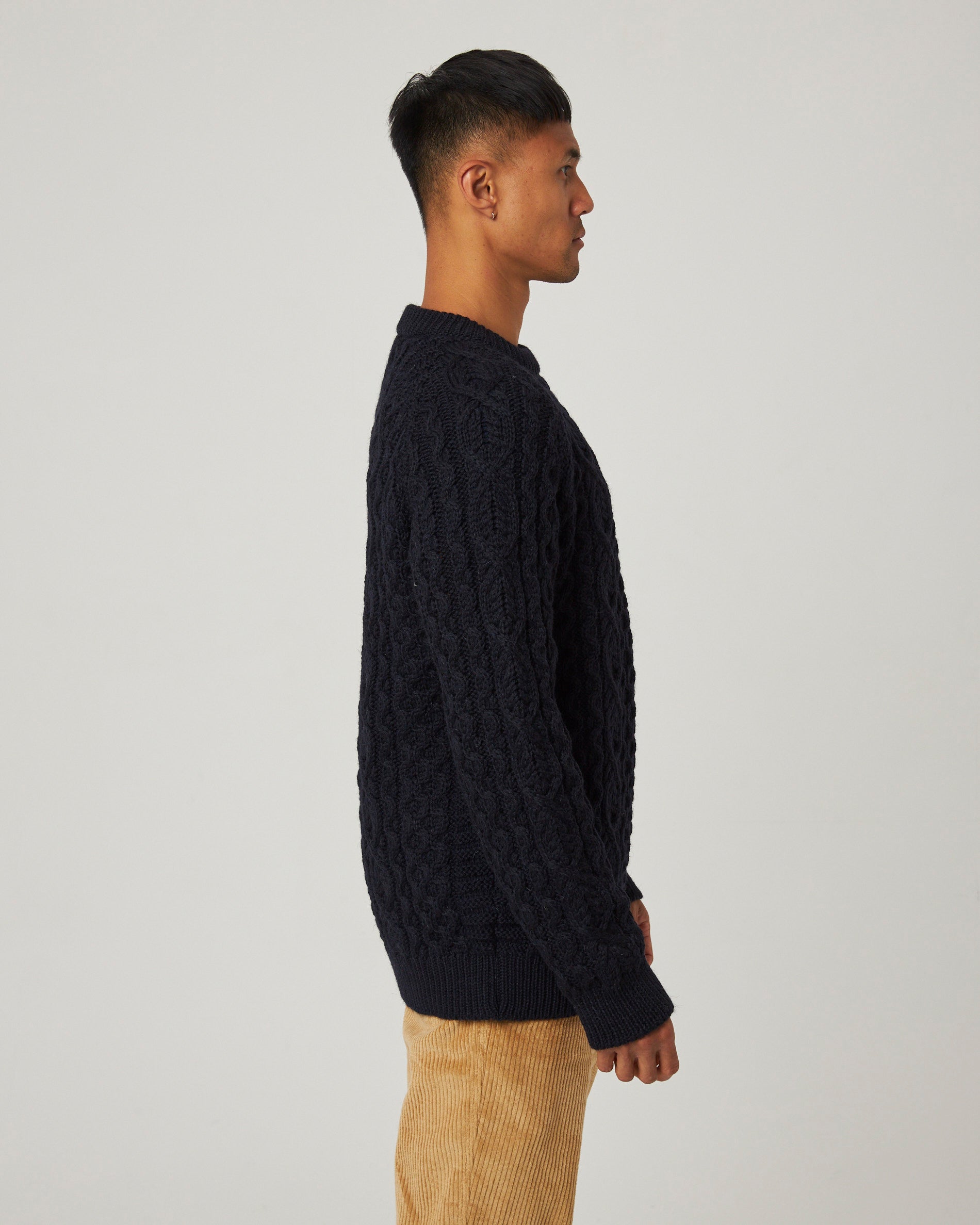 Image of model wearing Hudson Aran Jumper. Model is 6ft1in, chest size 38in and wearing size Medium