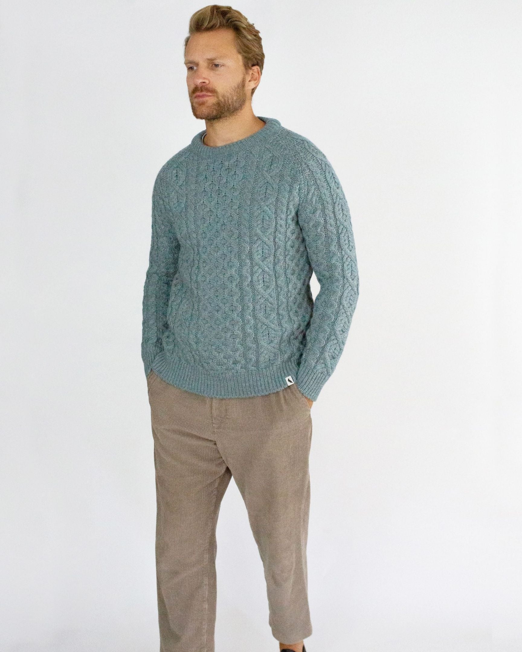 Image of model wearing Hudson Aran Jumper. Model is 6ft1in, chest size 40in and wearing size Large