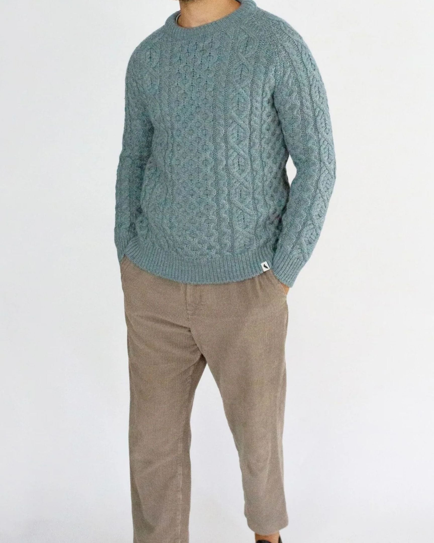 Image of model wearing Hudson Aran Jumper. Model is 6ft1in, chest size 40in and wearing size Large