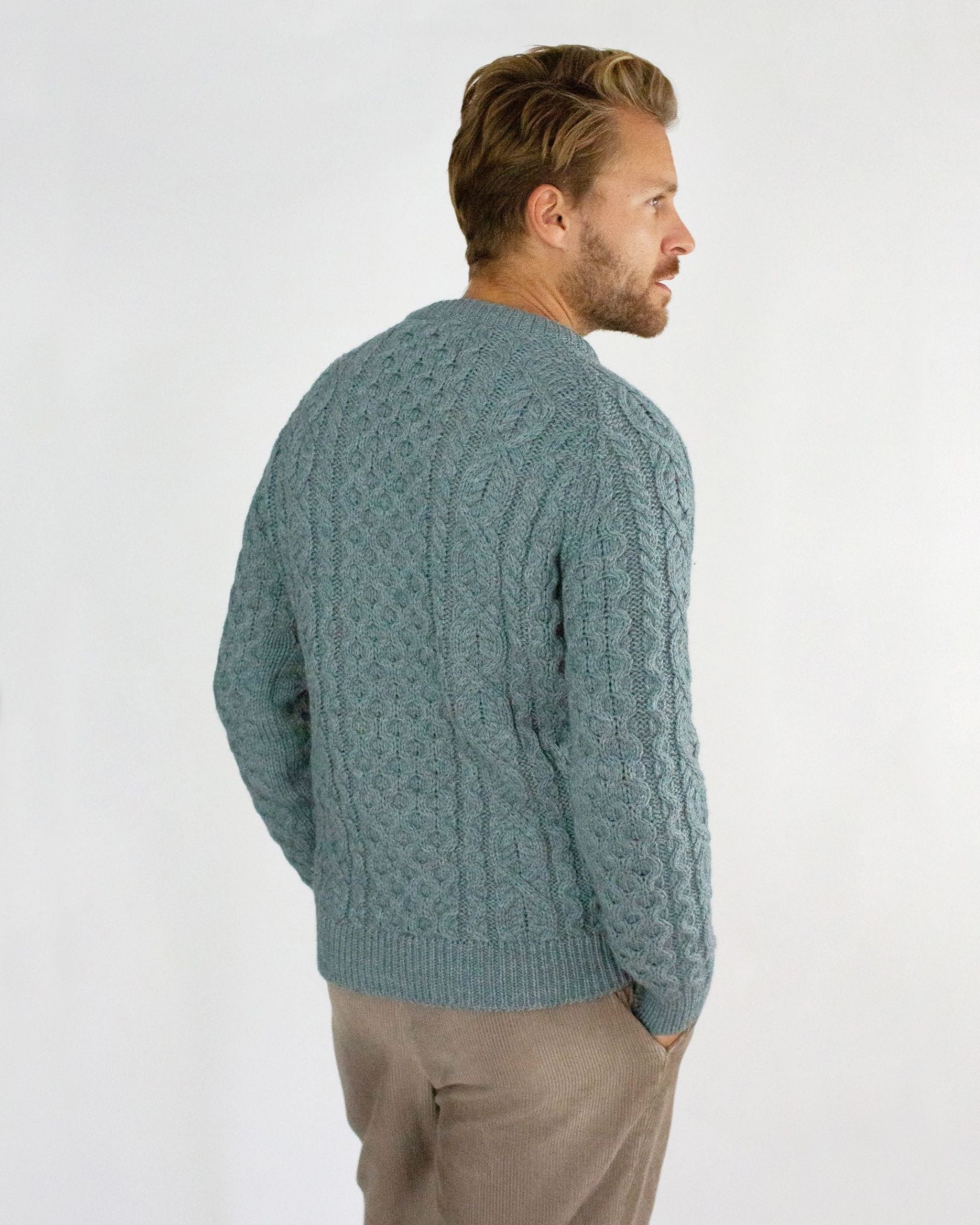 Image of model wearing Hudson Aran Jumper. Model is 6ft1in, chest size 40in and wearing size Large