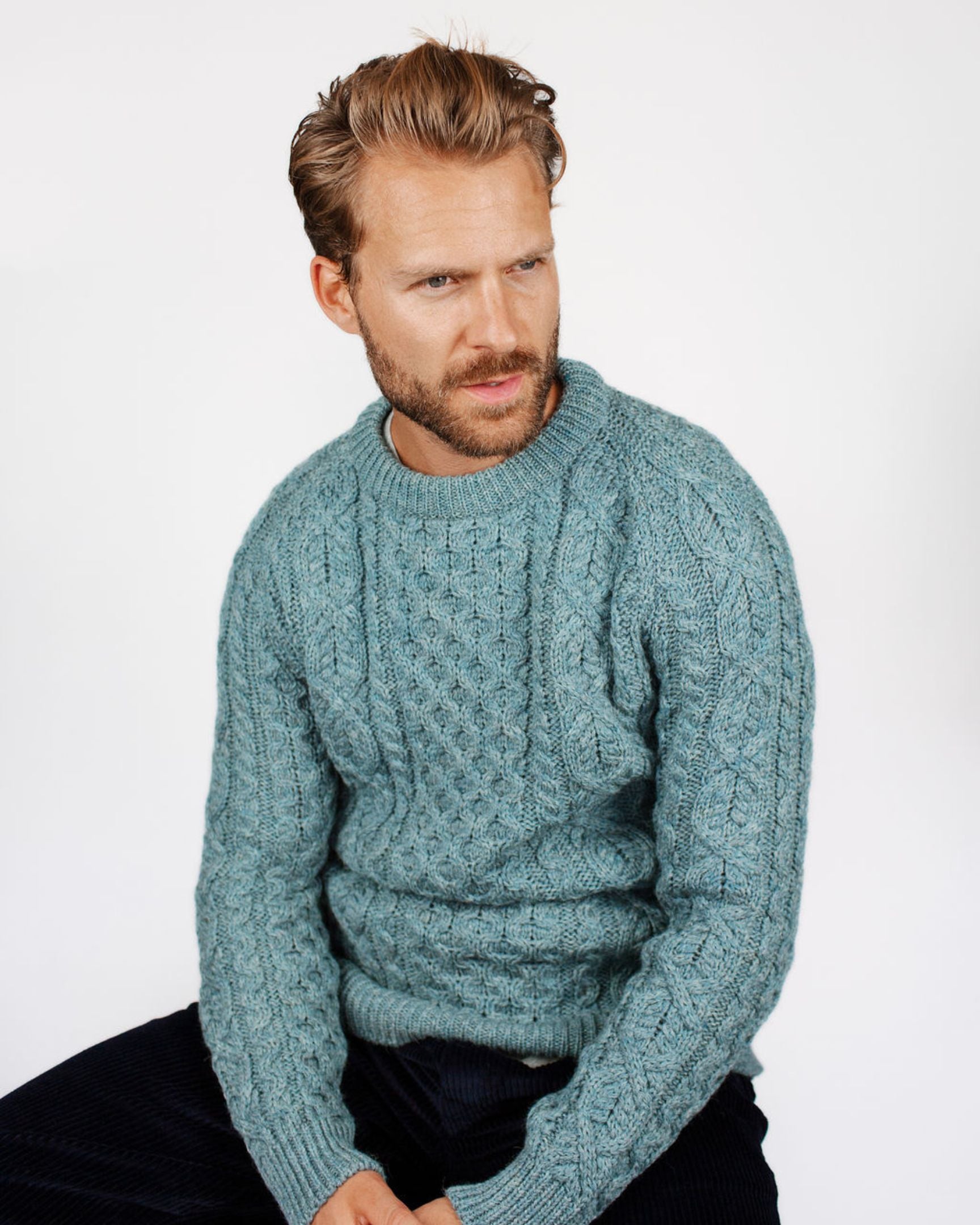 Image of model wearing Hudson Aran Jumper. Model is 6ft1in, chest size 40in and wearing size Large