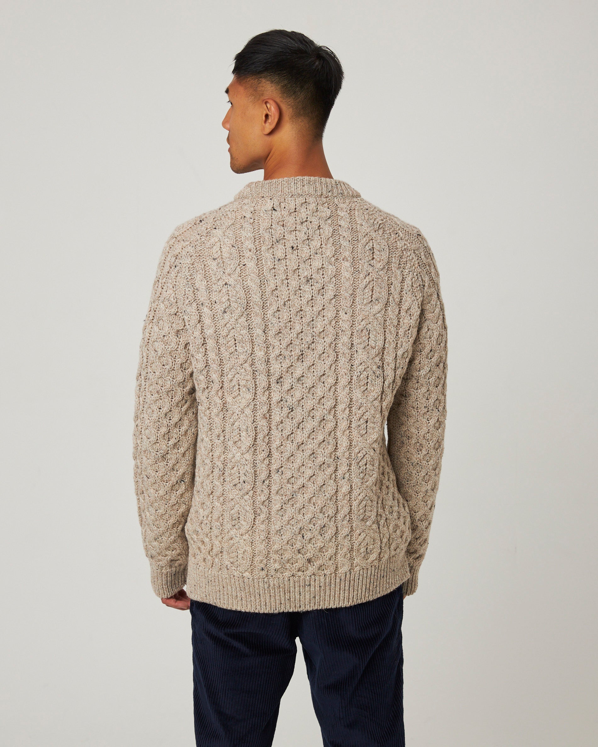 Image of model wearing Hudson Aran Jumper. Model is 6ft, chest size 36in and wearing size Large