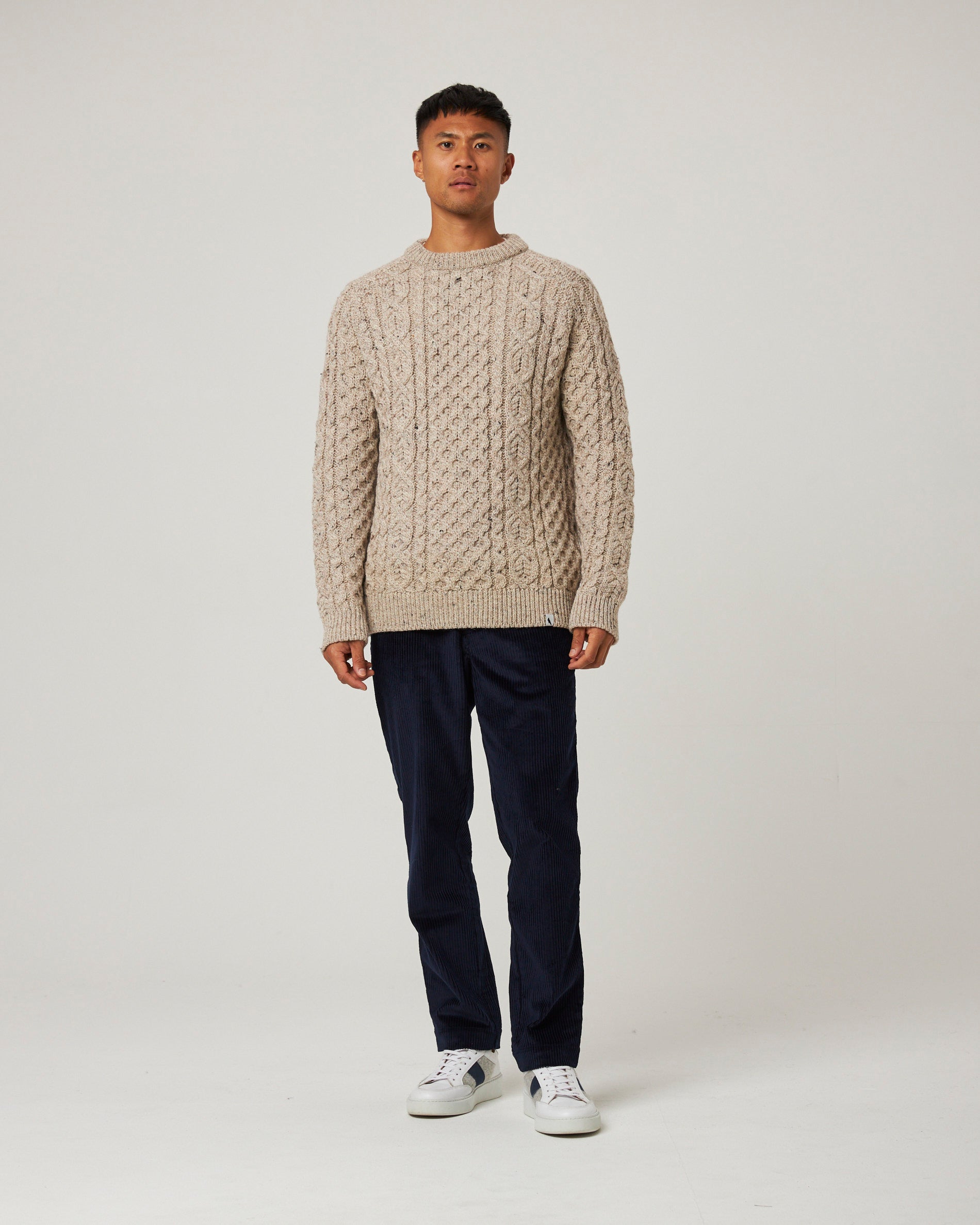 Image of model wearing Hudson Aran Jumper. Model is 6ft, chest size 36in and wearing size Large