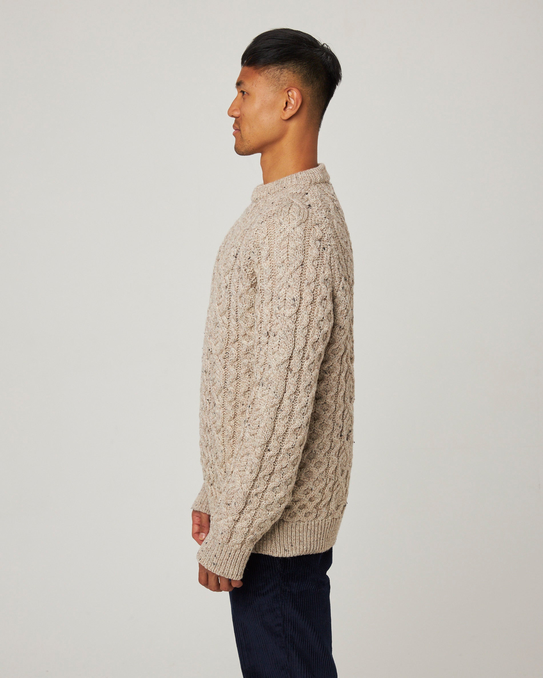 Image of model wearing Hudson Aran Jumper. Model is 6ft, chest size 36in and wearing size Large