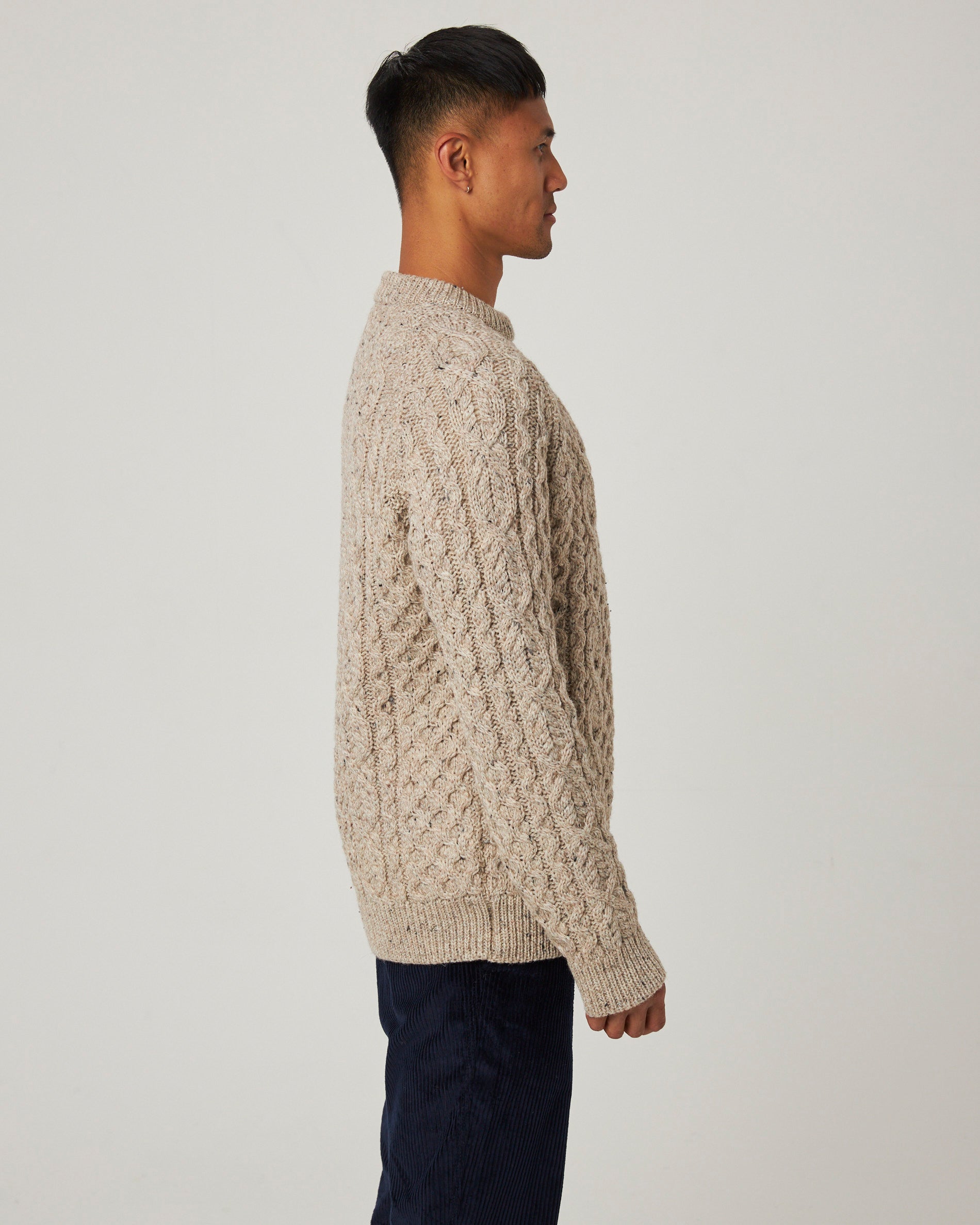 Image of model wearing Hudson Aran Jumper. Model is 6ft, chest size 36in and wearing size Large