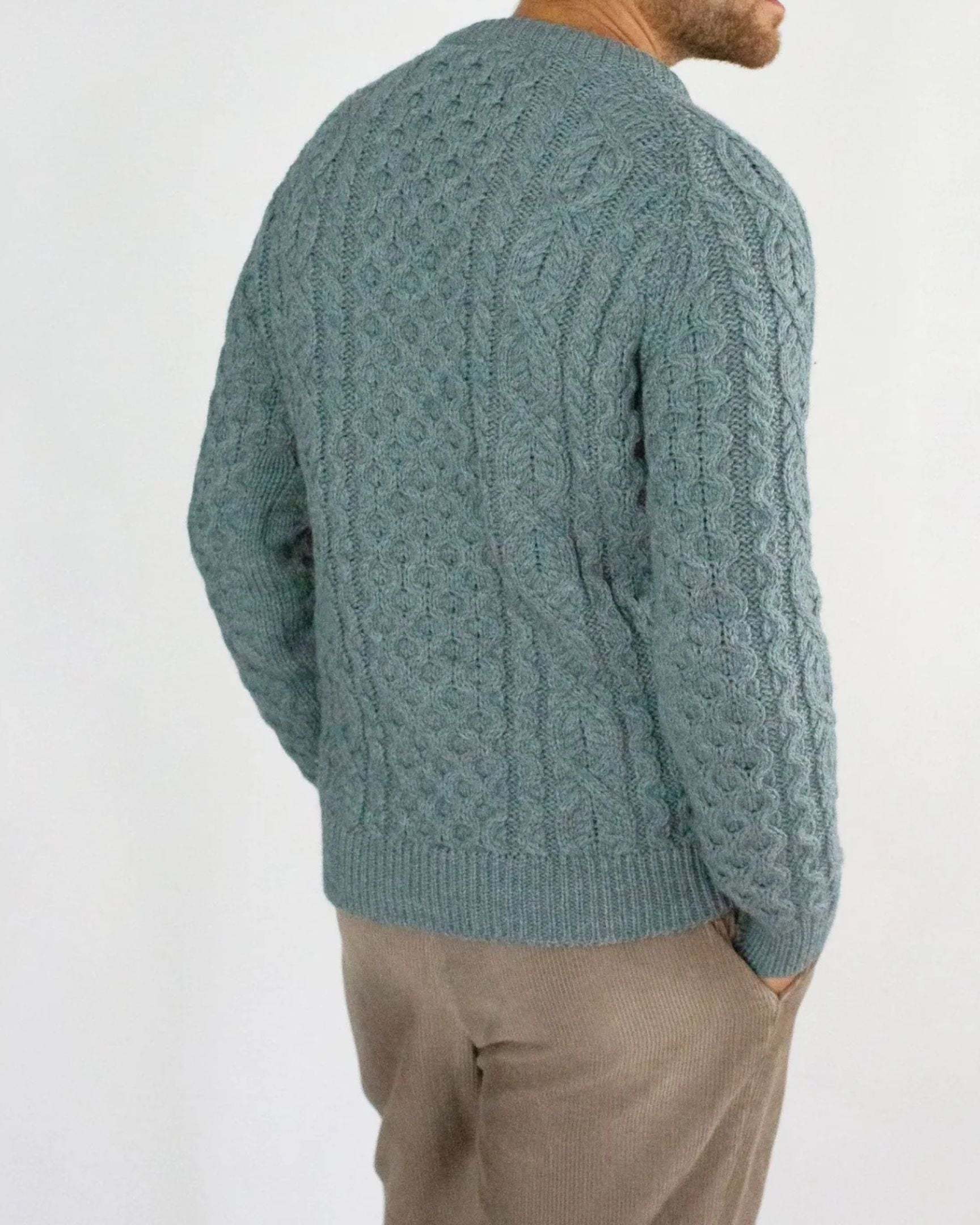 Image of model wearing Hudson Aran Jumper. Model is 6ft1in, chest size 40in and wearing size Large