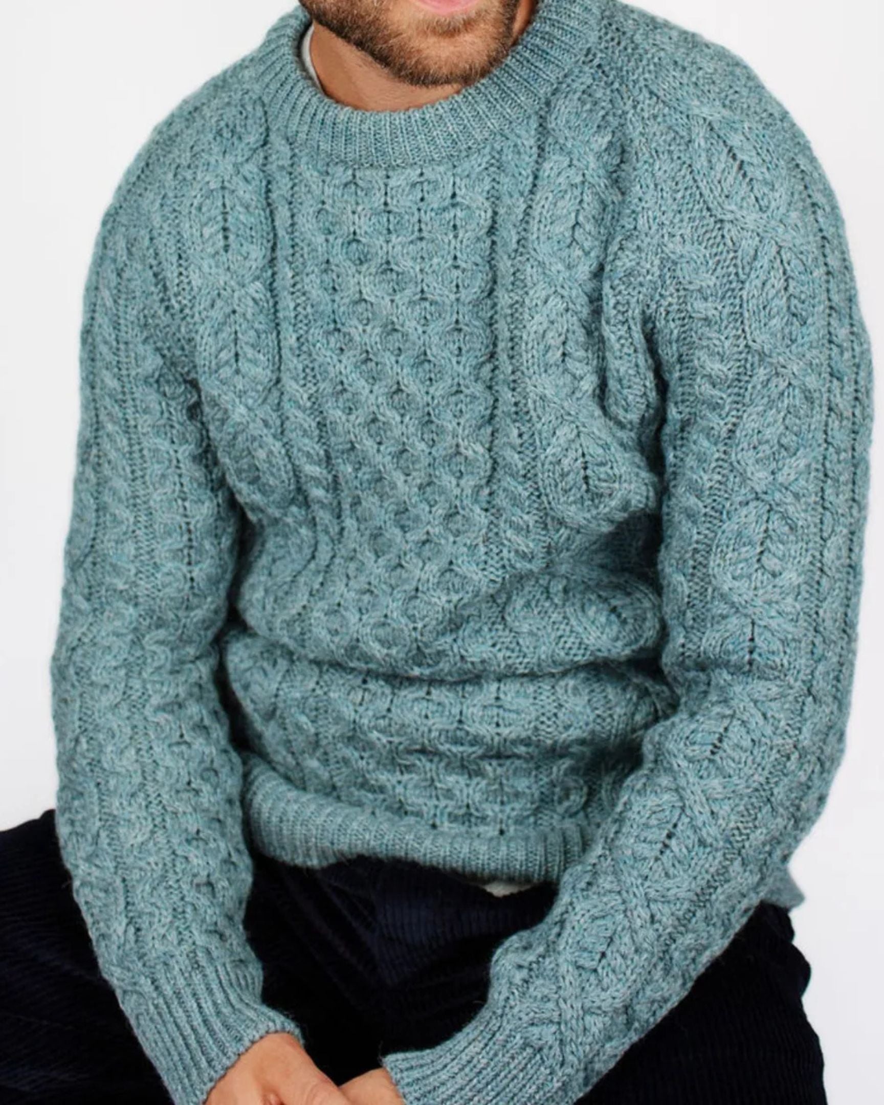Image of model wearing Hudson Aran Jumper. Model is 6ft1in, chest size 40in and wearing size Large
