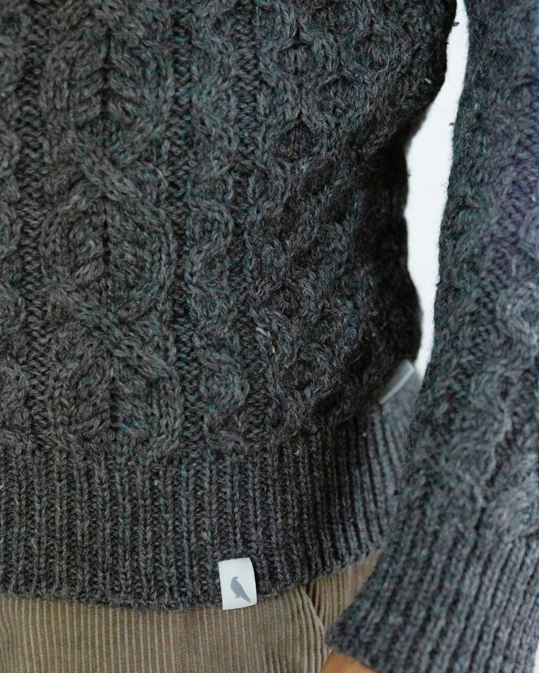 Image of model wearing Hudson Aran Jumper. Model is 6ft1in, chest size 38in and wearing size Medium