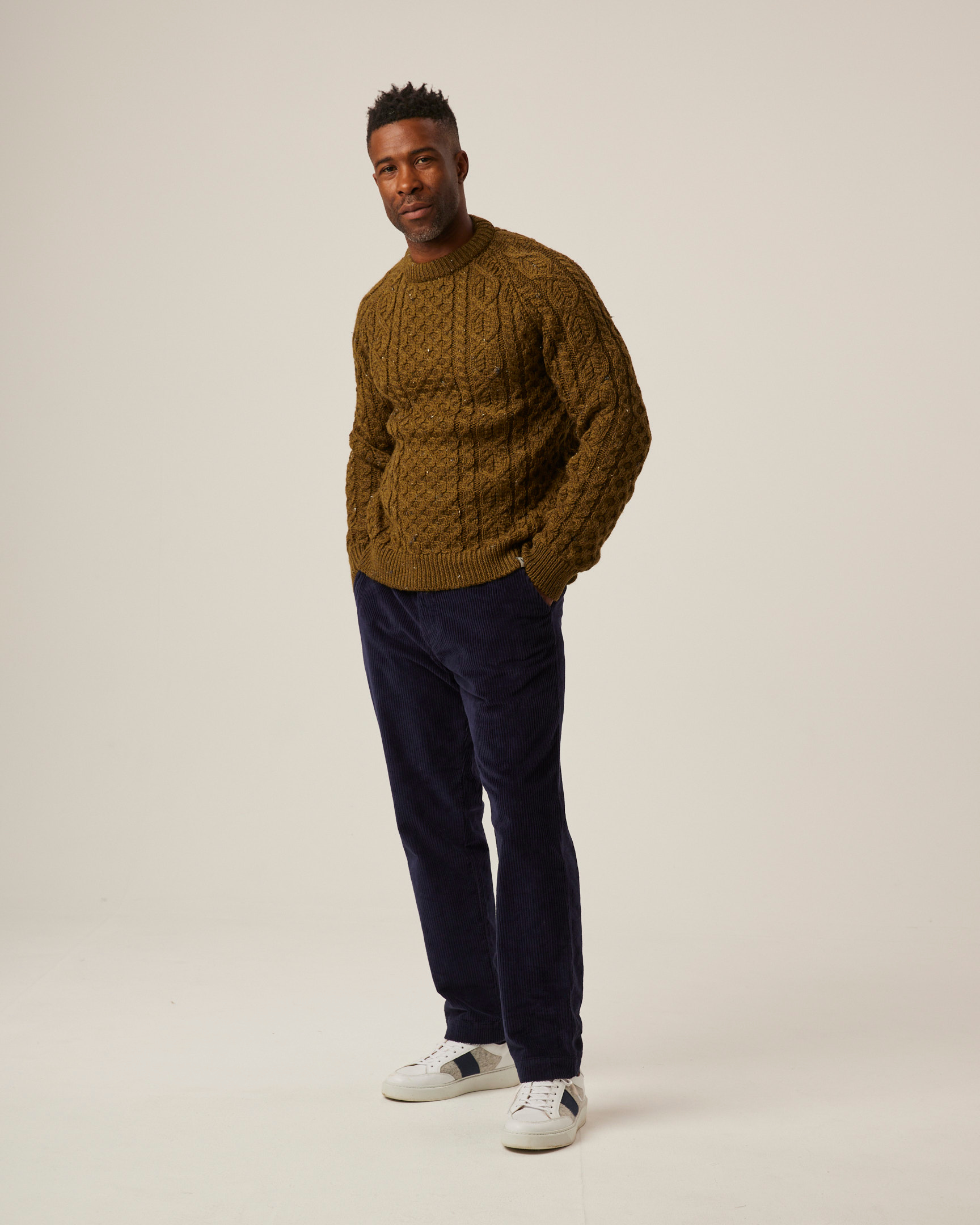 Image of model wearing Hudson Aran Jumper. Model is 6ft1in, chest size 38in and wearing size Medium